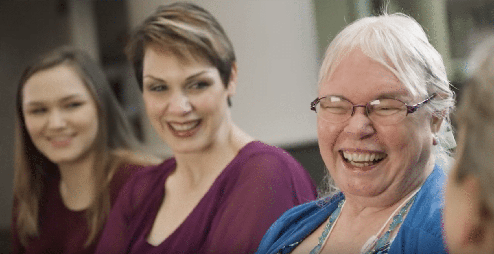 3 women smiling in waiting room